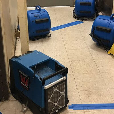 Four water damage restoration equipment on the floor